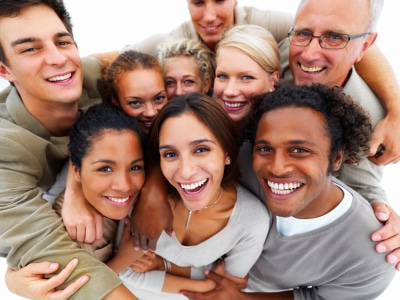 Portrait of business colleagues holding each other and smiling